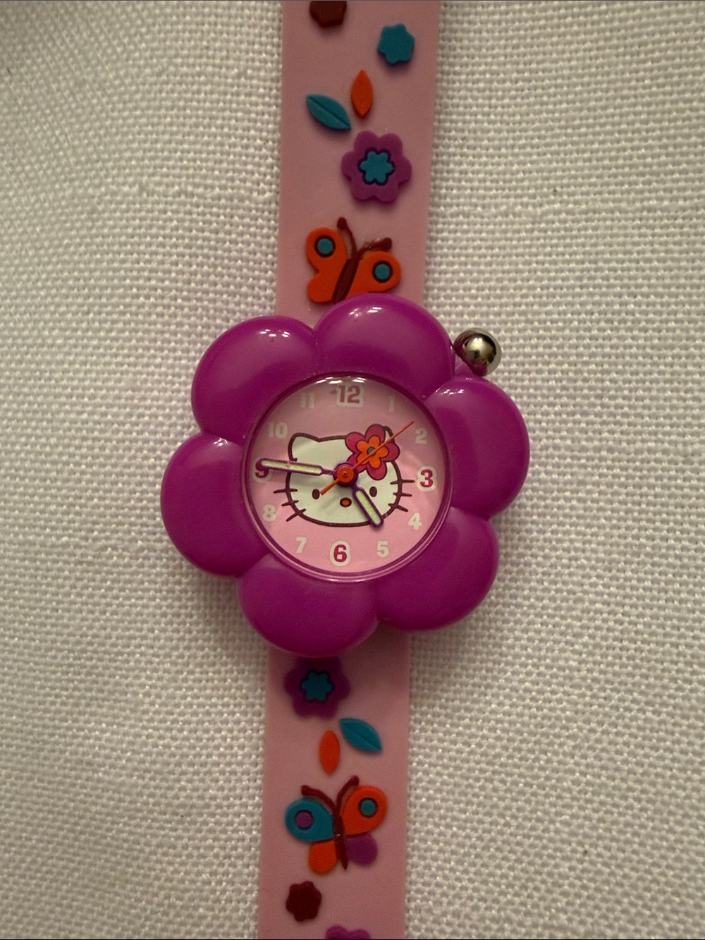 Vintage Sanrio Hello Kitty Pink Strap Kids Watch with Purple Flower Case. 2005